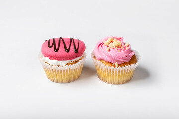 Cupcakes on a white background. Cupcakes with yogurt and strawberry cream. Strawberry cupcakes.