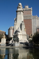 Fototapeta na wymiar Plaza de España con el monumento a Cervantes en el centro urbano de la ciudad de Madrid, capital de España