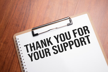 Thank you For Your support text on white paper on the wood table