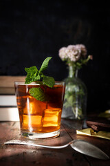 Ice cold infusion of mint with ounces of dark chocolate. Summer plans for a quiet afternoon. Mint, chocolate and books at sunset