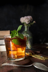 Ice cold infusion of mint with ounces of dark chocolate. Summer plans for a quiet afternoon. Mint, chocolate and books at sunset