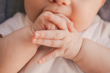 Newborn Baby sucking his fingers