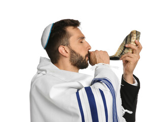 Jewish man with kippah and tallit blowing shofar on white background. Rosh Hashanah celebration
