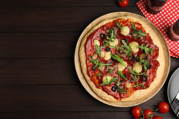 Pita pizza with cheese, olives, mushrooms and arugula on wooden table, flat lay. Space for text