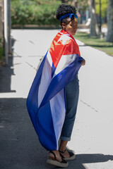 Close up of a latin woman wearing the cuban flag smiling at the camera