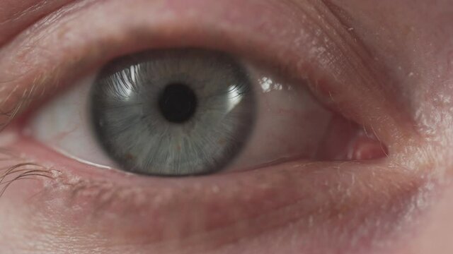 Unrecognizable woman rubbing eye and blinking