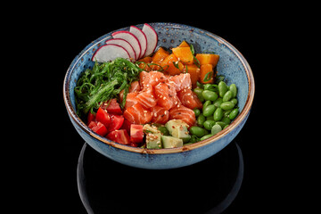 Poke bowl of salmon, mango, tomatoes, avocados, edamame beans, wakame seaweed, radish