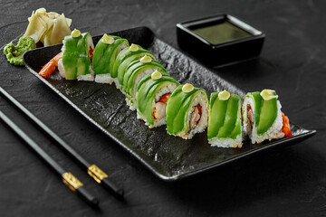 Shrimp, tobiko and cream cheese sushi rolls with avocado