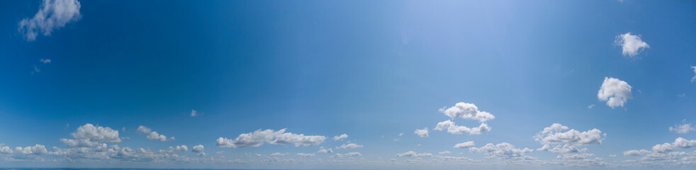 Panorama of blue sky with white clouds