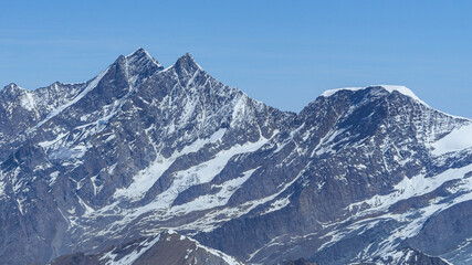 The peaks and glaciers of the Mischabel massif: one of the highest and most spectacular mountain...