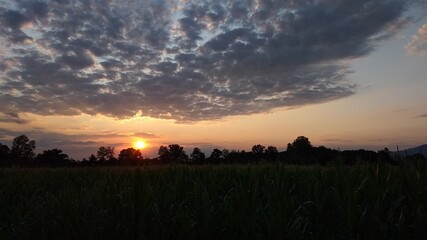 Sunset in cloudy sky