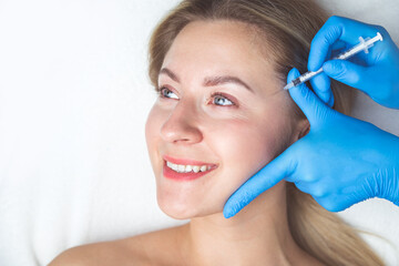 Rejuvenating facial injections procedure for tightening and smoothing wrinkles on the face skin