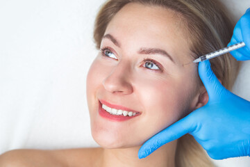 Rejuvenating facial injections procedure for tightening and smoothing wrinkles on the face skin