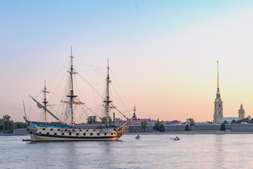 Russian old sailing warship Poltava parked on the Neva against the background of the Peropavloskaya fortress