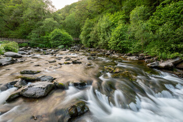 Fototapeta premium Long exposure of a waterfall on the East Lyn river at Watersmeet In Exmoor National Park