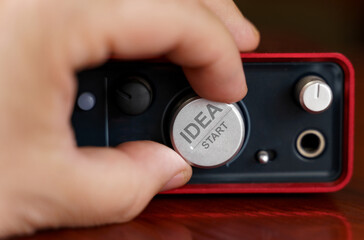 The businessman turns the regulator on which it is written - IDEA