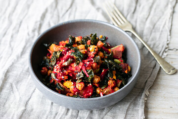 Vegan salad of chickpeas, crispy kale, beetroot and avocado