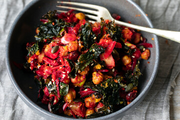 Vegan salad of chickpeas, crispy kale, beetroot and avocado