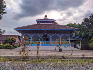 a small mosque in the village, with a large yard