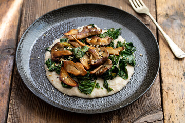 White bean puree with crispy kale and mushrooms