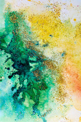 watercolor stains yellow-green with sparkles. Abstract background
