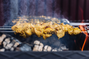 Pork kebab on skewers is fried on the grill