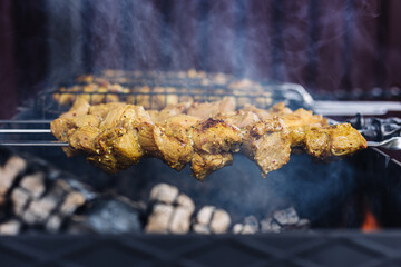 Pork kebab on skewers is fried on the grill