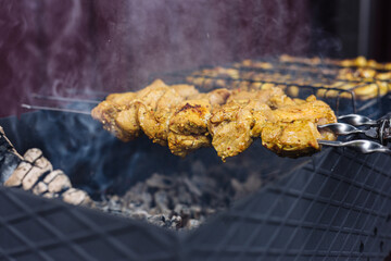 Pork kebab on skewers is fried on the grill