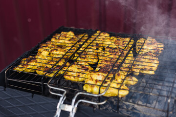 Chicken kebab is cooked on the grill