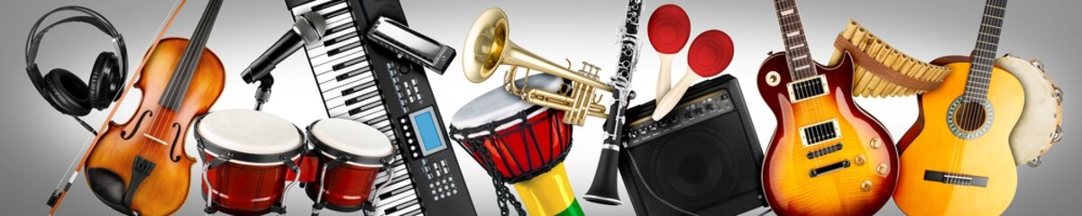 wide panorama collage banner  of various musical instruments. Guitar keyboard Brass percussion studio music concept grey background - obrazy, fototapety, plakaty
