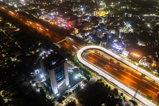 Haryana, india - 02 May 2021: Aerial view of Airtel Overbridge and a complex road intersection at night in Gurgaon, Haryana, India.