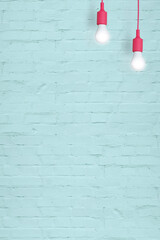 Blue brick wall with light bulbs with copy space. Vertical format