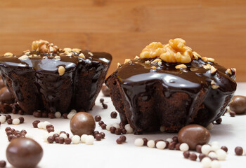 delicious chocolate candie with nuts  on the top under the white table