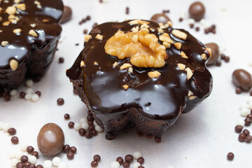 delicious chocolate candie with nuts  on the top under the white table