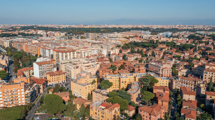 Fototapeta na wymiar Typical Rome cityscape aerial panorama, Italy. Residential buildings with orange roofs.