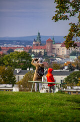 Fototapeta na wymiar people on the hill - cracow view