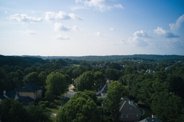 Aerial view of a sub division with beautiful landscape and houses