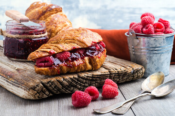 croissant with raspberries and raspberry jam © kosoff