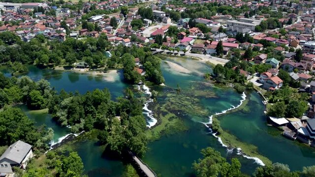 Aerial drone view Bihac and Una river in Bosnia and Herzegovina. Buildings, streets and residential houses. Bihać is a town and municipality in western BiH.