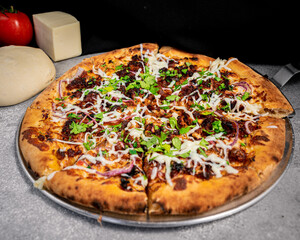 Appetizing pressed crackling pizza, on a base.