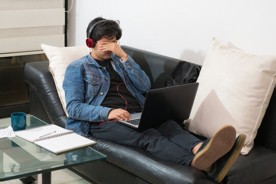 young student with exhaustion from studying in virtual classes