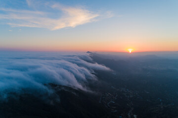 Fototapeta na wymiar Aerials Malibu Santa Monica Mountains Sunset Misty Covered, California
