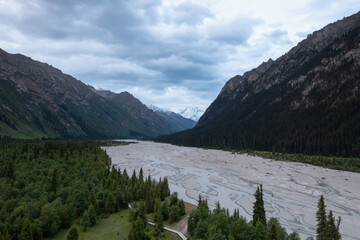 River and mountains with white clouds.