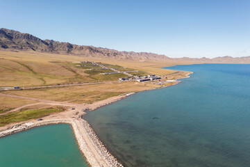 Lake and grassland with a sunny day. Shot in Sayram Lake in Xinjiang, China.