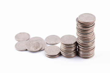 Some stacks of dollar coins on white background