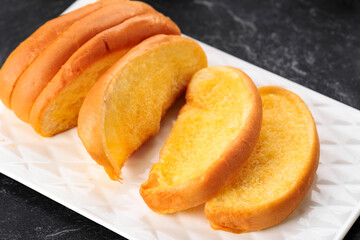 Roti Sisir Jadul, Homemade Sweet Soft Pull Over Bread with Margarine and Sugar Spread. Served ob White Plate, Selected Focus