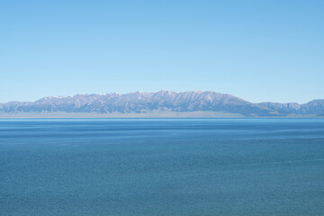 Lake and mountains in a sunny day. Shot in Sayram Lake in Xinjiang, China.