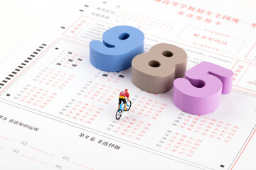 The word 985 on the answer sheet and the biking doll