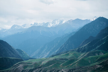 Snowy mountains and peaks in a sunny day.