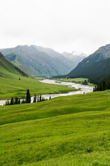 River and mountains with white clouds.